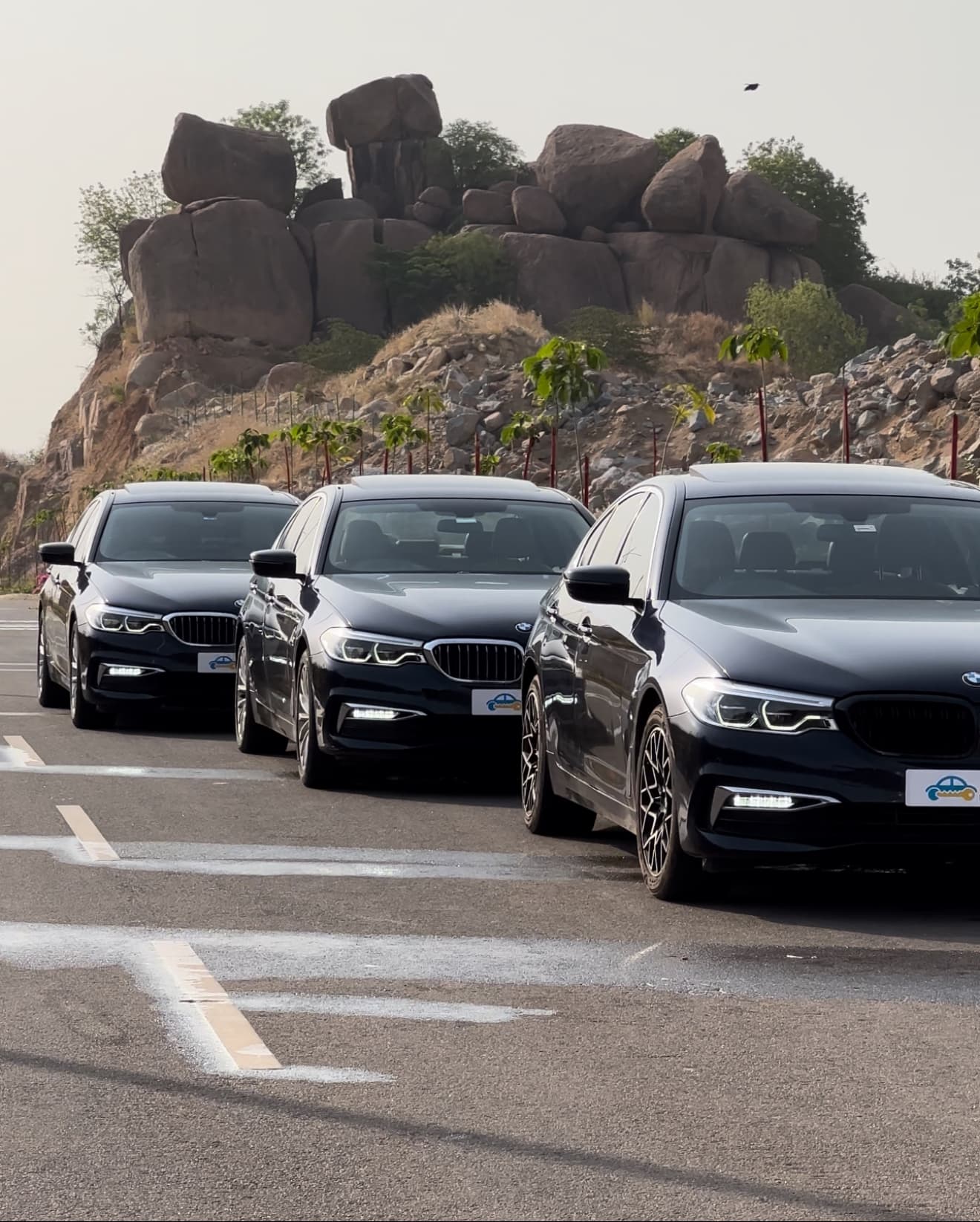 Ridehire chauffeur opening a luxury car door